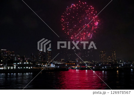 Fireworks display over Yokohama Port during a lively festival celebration at night 126978567