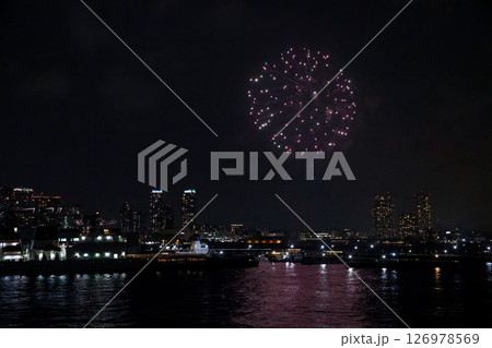 Fireworks display over Yokohama Port during a lively festival celebration at night 126978569