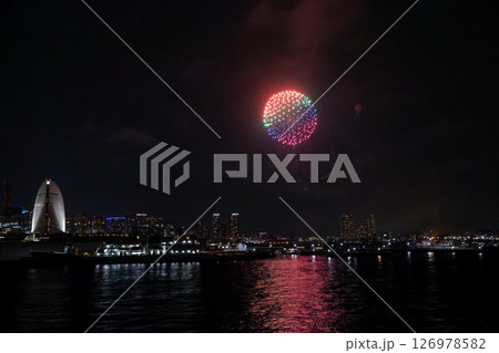 Fireworks display over Yokohama Port during a lively festival celebration at night Fireworks display over Yokohama Port during a lively festival celebration at night 126978582