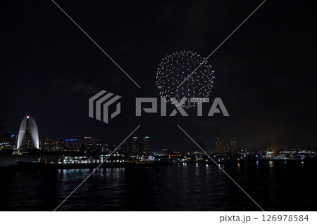 Fireworks display over Yokohama Port during a lively festival celebration at night 126978584