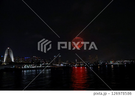 Fireworks display over Yokohama Port during a lively festival celebration at night 126978586