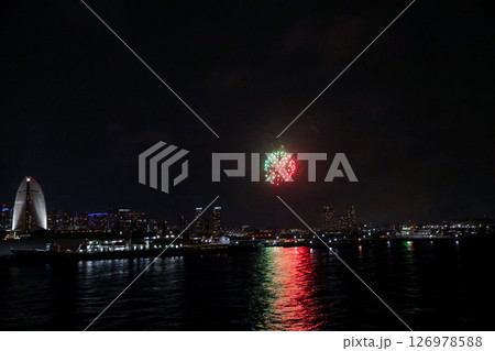 Fireworks display over Yokohama Port during a lively festival celebration at night 126978588