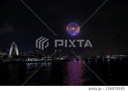 Fireworks display over Yokohama Port during a lively festival celebration at night 126978593