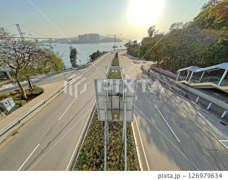 Hong Kong car road with bridge, buildings, island in perspertive view 126979634