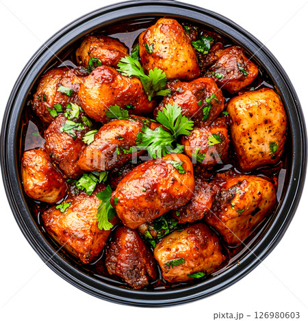Crispy Spiced Potatoes Garnished with Fresh Green Herbs and Rich Sauce 126980603