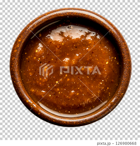 Rich and Spicy Brown Sauce in a Rustic Bowl on a Dark Background 126980668