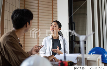 ESG Collaboration. Architect explaining design ideas during a project meeting. 126981557