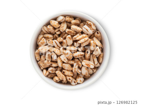 Top view bowl with honey rice crispies breakfast cereal on white.Macro. Top view bowl with honey rice crispies breakfast cereal on white.Macro. 126982125