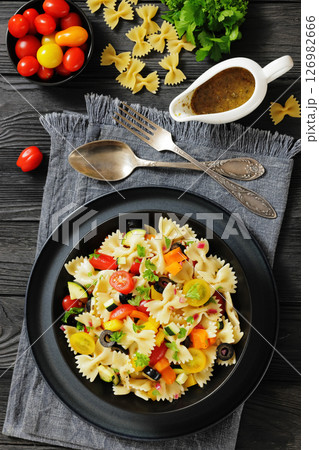 salad of farfalle pasta with veggies and olives 126982666