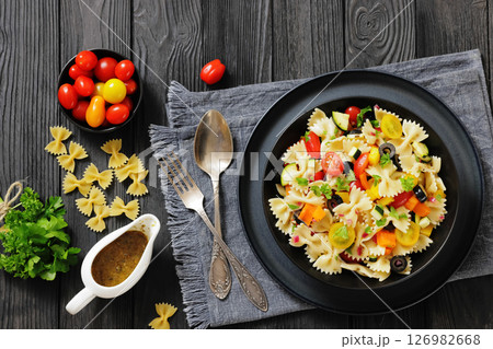 salad of farfalle pasta with veggies and olives 126982668