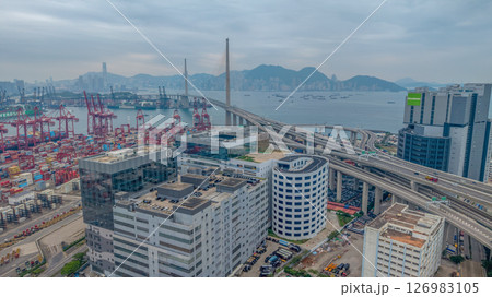 May 25 2025 Large Seaport with Stacked Containers and Cranes in Urban Area May 25 2025 Large Seaport with Stacked Containers and Cranes in Urban Area 126983105
