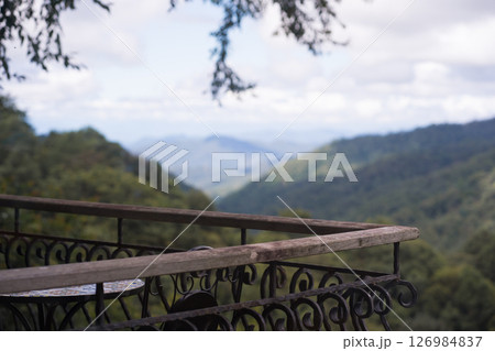 digital nomad concept wooden terrace with mountain view of coffeeshop digital nomad concept wooden terrace with mountain view of coffeeshop 126984837