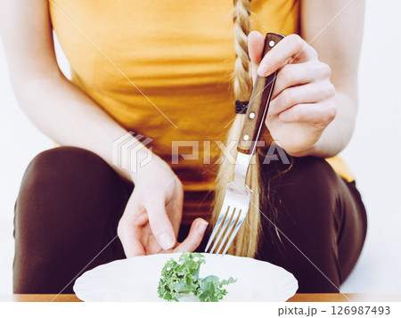 Woman with diet lettuce meal 126987493