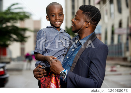 portrait of young man and his child. 126988078