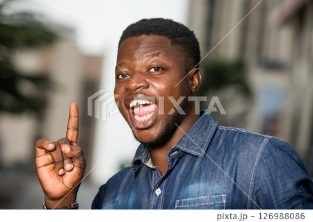 happy man with hands gesture outside happy man with hands gesture outside 126988086
