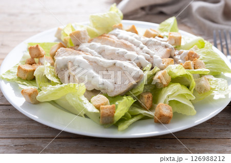Crunchy Caesar salad with chicken Crunchy Caesar salad with chicken 126988212