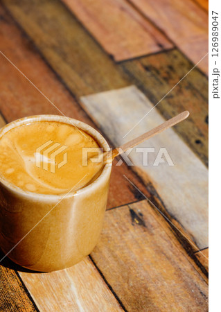 french noisette in a ceramic cup on a table 126989047