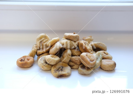 Many tasty dried figs as background, top view Many tasty dried figs as background, top view 126991076