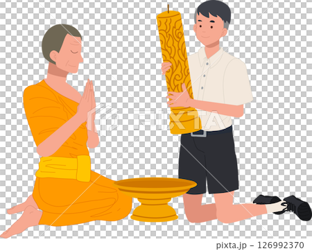 A young Thai student offers a candle to a monk during Khao Phansa at a temple 126992370
