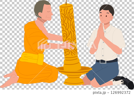 A young Thai student offers a candle to a monk during Khao Phansa at a temple 126992372