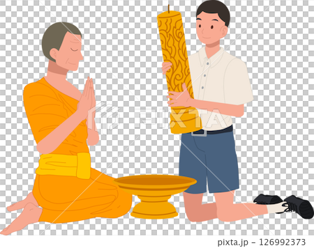 A young Thai student offers a candle to a monk during Khao Phansa at a temple 126992373