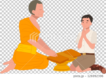 A Thai student boy offers a bathing robe to a monk during Buddhist Lent 126992396