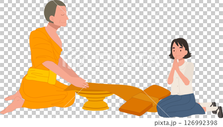 A Thai student girl offers a bathing robe to a monk during Buddhist Lent 126992398