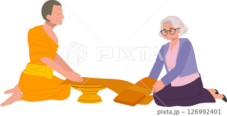 thai buddhist tradition elderly woman offering robe to monk on buddhist lent day thai buddhist tradition elderly woman offering robe to monk on buddhist lent day 126992401