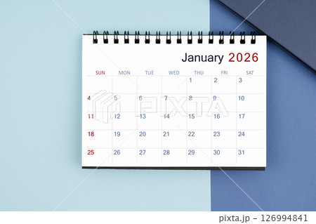 January 2026 monthly desk calendar for 2025 year on blue background. January 2026 monthly desk calendar for 2025 year on blue background. 126994841