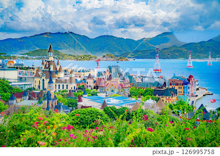 An island with an amusement park. 126995758