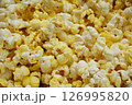 Close up of Buttered Popcorn Crispy and Delicious Snack. Snack food for movies background image. 126995820
