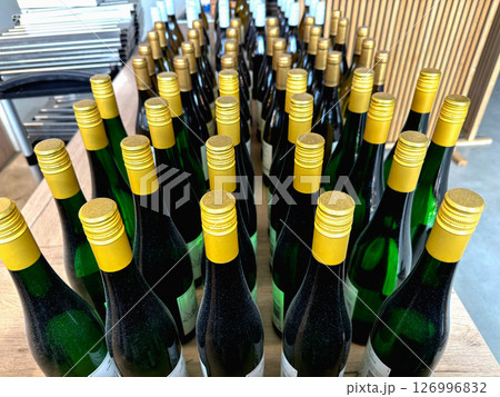 Bottles of white wine lined up Bottles of white wine lined up 126996832