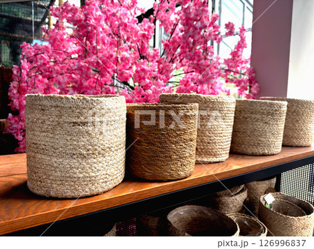 Various woven basket on shelves indoors 126996837