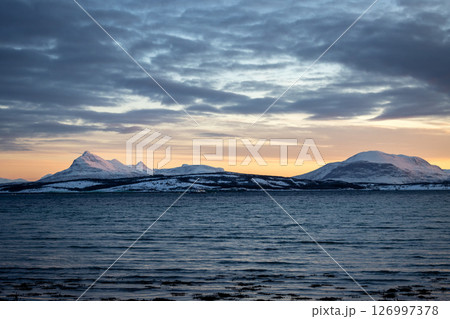 Sea and mountains with snow in the sunset, Norway Sea and mountains with snow in the sunset, Norway 126997378