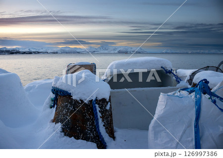Industrial place with snow during sunset, Norway 126997386