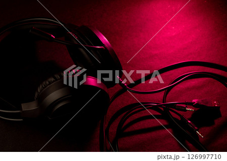 Black headphones on a dark background Black headphones on a dark background 126997710