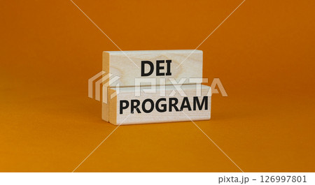 DEI diversity equity inclusion program symbol. Blocks with words DEI program on beautiful orange background. Business DEI diversity equity inclusion program concept. Copy space. 126997801