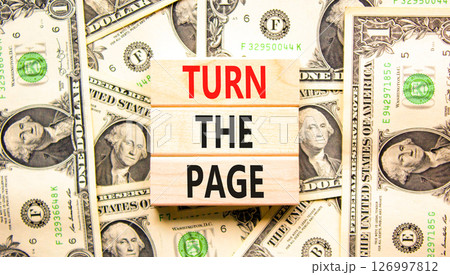 Turn the page symbol. Concept words Turn the page on beautiful wooden block. Dollar bills. Beautiful background from dollar bills. Business motivational lifestyle turn the page concept. Copy space. Turn the page symbol. Concept words Turn the page on beautiful wooden block. Dollar bills. Beautiful background from dollar bills. Business motivational lifestyle turn the page concept. Copy space. 126997812