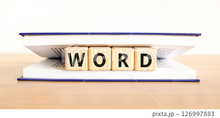 Word symbol. Concept word Word on beautiful wooden blocks in book. Beautiful wooden table white background. Business, lifestyle, support and word concept. Copy space. 126997883