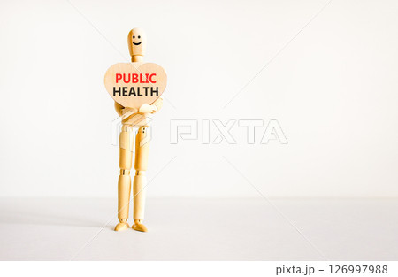 Public health symbol. Concept words Public health on beautiful wooden heart. Doctor's model. Beautiful white background. Copy space. Medical healthy lifestyle public health concept. Public health symbol. Concept words Public health on beautiful wooden heart. Doctor's model. Beautiful white background. Copy space. Medical healthy lifestyle public health concept. 126997988