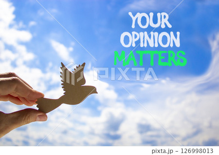 Your opinion matters symbol. Concept words Your opinion matters on beautiful blue sky. Beautiful blue sky and clouds background. Businessman hand. Business your opinion matters concept. Copy space. Your opinion matters symbol. Concept words Your opinion matters on beautiful blue sky. Beautiful blue sky and clouds background. Businessman hand. Business your opinion matters concept. Copy space. 126998013