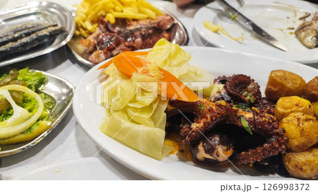 Polvo a Lagareiro, Grilled Octopus with boiled potatoes, in a Restaurant in Porto, Portugal 126998372
