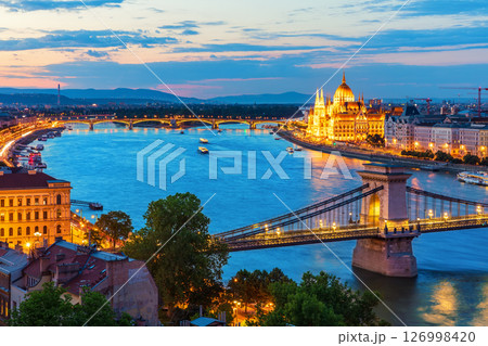 Famous Chain Bridge of Budapest, view on the main landmarks of Hungary, beautiful night lights Famous Chain Bridge of Budapest, view on the main landmarks of Hungary, beautiful night lights 126998420