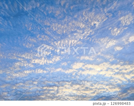 white clouds, thick clouds like sea waves. abstract blue sky background with thick clouds. 126998483