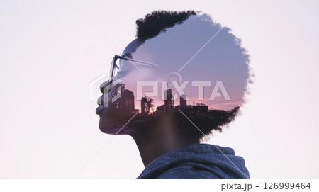 Double exposure of a black female astronaut with futuristic cityscape Double exposure of a black female astronaut with futuristic cityscape 126999464