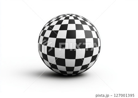 Checkered ball placed on a smooth surface showcasing a bold black and white pattern during daylight hours 127001395
