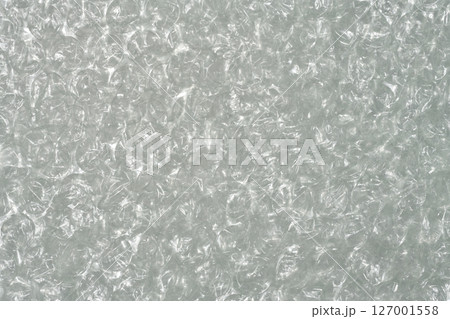 Full frame close up of clear plastic bubble wrap, creating a textured background 127001558