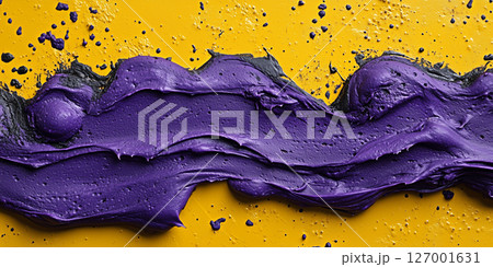 Abstract art concept with bright purple and black textured paint on yellow background 127001631