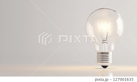 Illuminated light bulb on a minimalist background, symbolizing creativity, innovation, and bright ideas. Ideal startups, eco-innovation, or tech themes 127001635