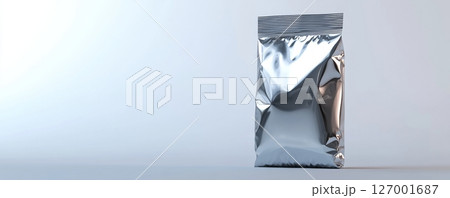 Silver foil pouch on white background, minimal design. Modern product packaging concept Silver foil pouch on white background, minimal design. Modern product packaging concept 127001687